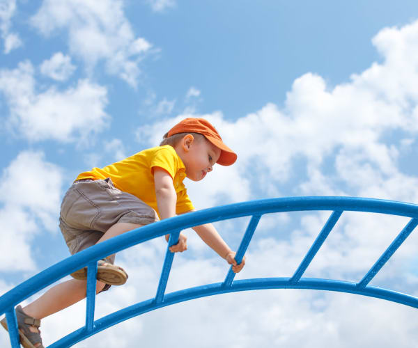 A child playing at a playground at Capeharts East in San Diego, California