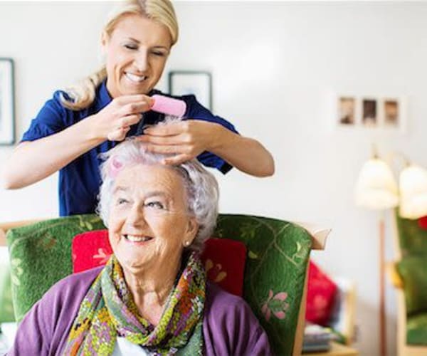 Resident getting their hair done at Pacifica Senior Living Forest Trace in Lauderhill, Florida