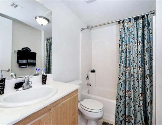 Bathroom with bathtub at Casa Bella in Victorville, California