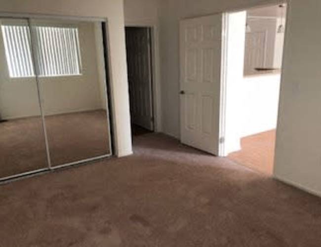 Unfurnished living room showing glass partition door at Oceana Apartments in , California