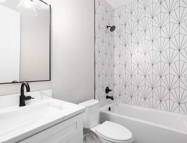 Bathroom with bathtub at Parkdale Villas in Denison, Texas 