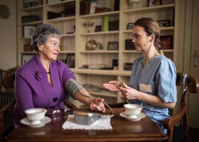 Resident and nurse consulting at Westminster Memory Care in Aiken, South Carolina