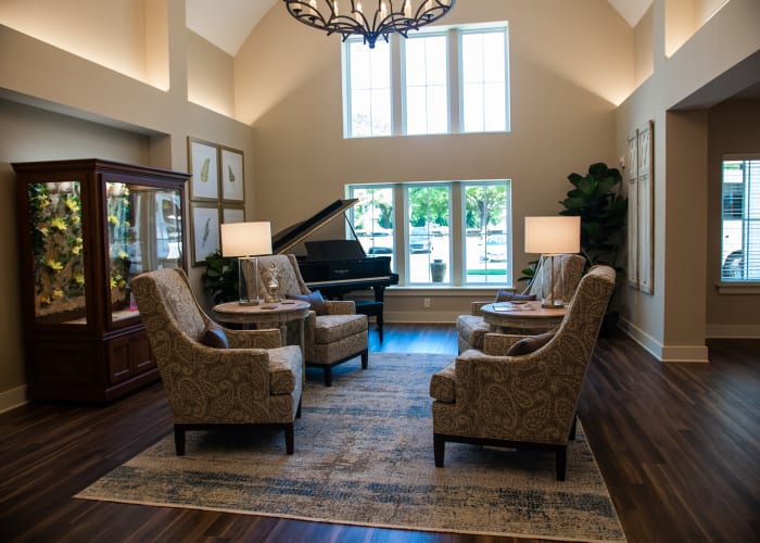 Inviting lobby with piano and easy chairs at Westminster Memory Care in Aiken, South Carolina