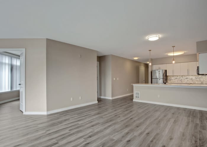 Hardwood flooring throughout the living areas of a model apartment home at 700 Broadway in Seattle, Washington