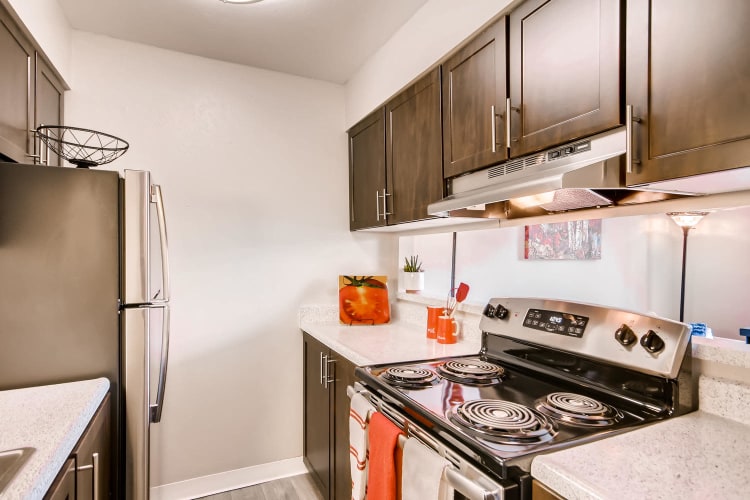 Spacious kitchen with white cabinets in a model home at Mountain Vista in Lakewood, Colorado
