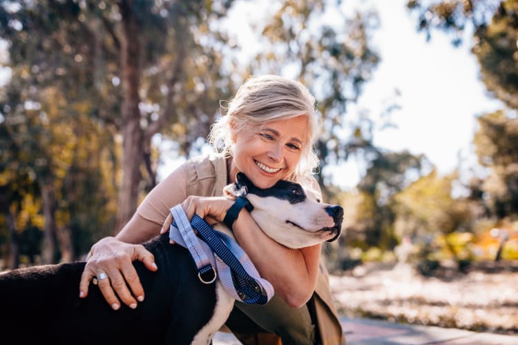 Resident and her dog loving their new neighborhood near Lumen Apartments in Everett, Washington