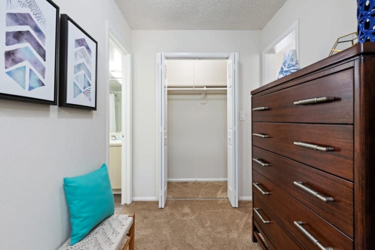 Bedroom storage area with dresser at Executive Apartments in Miami Lakes, Florida