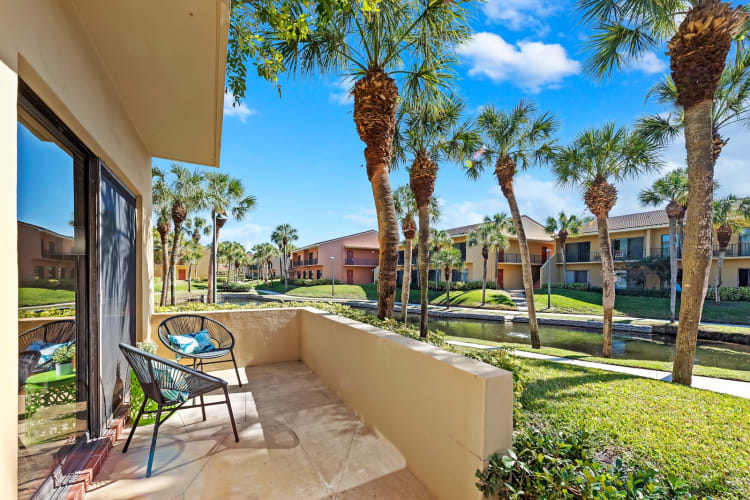 Gorgeous private patio with tropical views at Executive Apartments in Miami Lakes, Florida