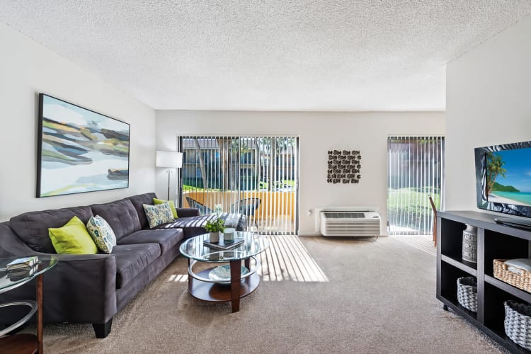 Bright and spacious model living room at Executive Apartments in Miami Lakes, Florida