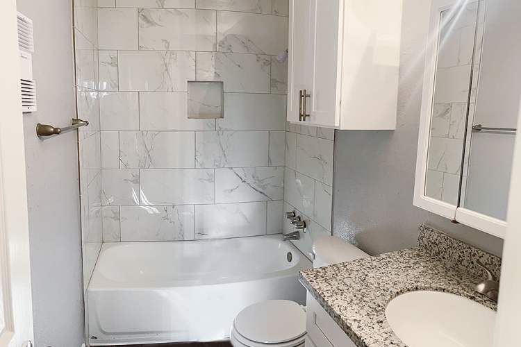 Bright bathroom with shower and tub at Oaks of Wimbledon in Spring, Texas, 