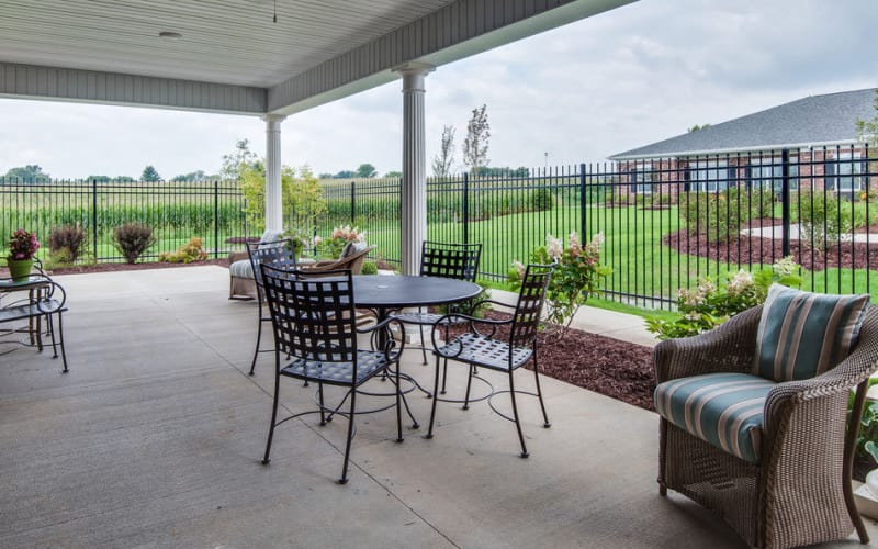 Outdoor patio with chairs at Ravenwood Terrace Senior Living in Moberly, Missouri