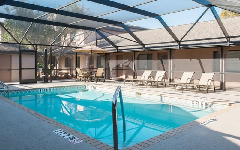 Covered swimming pool at Grand Villa of Englewood in Englewood, Florida