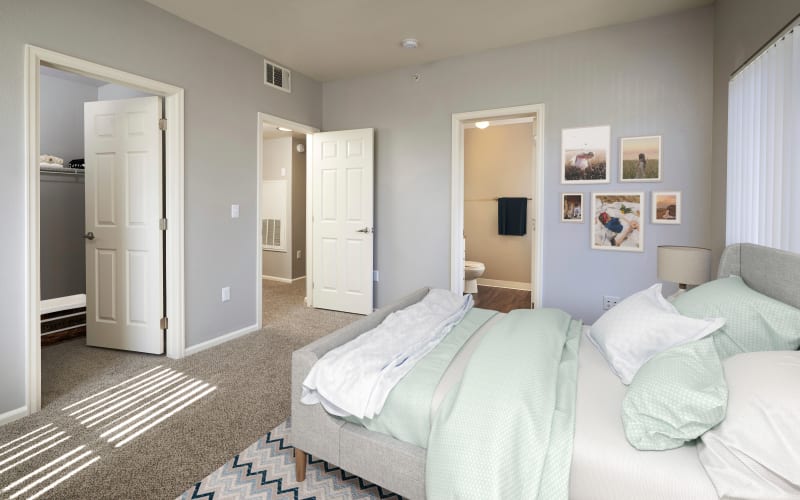 Spacious bedroom with plush carpeting at Westridge Apartments in Aurora, Colorado