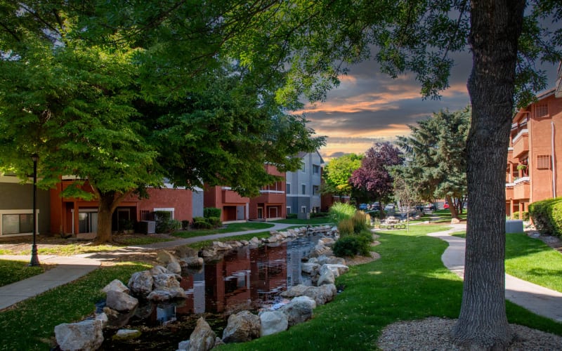 View of the brook and beautiful trees at Shadowbrook Apartments in West Valley City, Utah