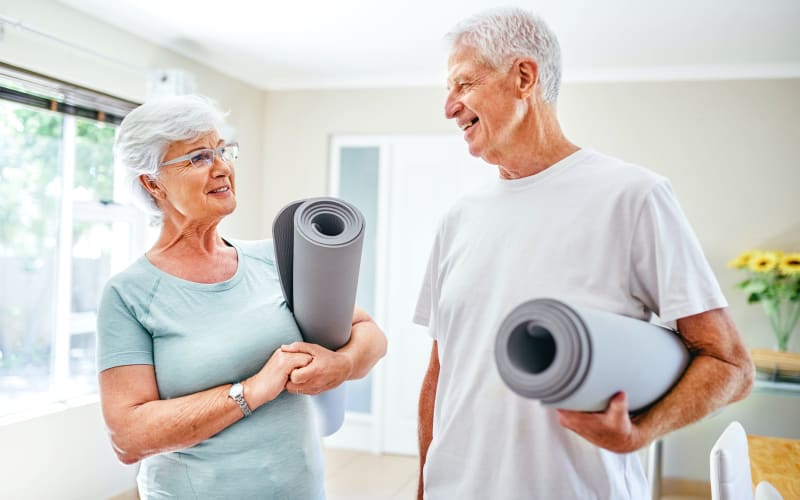 A couple with yoga mats at Blossom Springs in Oakland Twp, Michigan