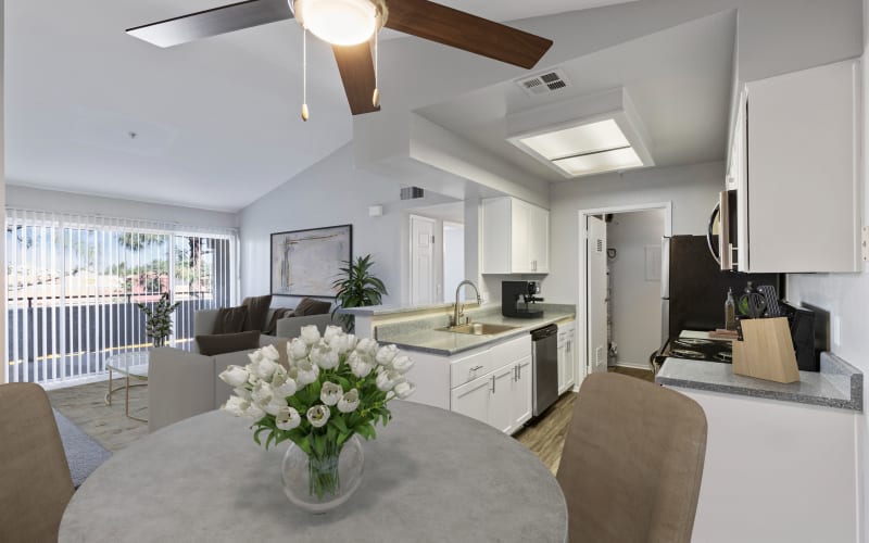 Renovated kitchen with stainless steel appliances at Sierra Del Oro Apartments in Corona, California
