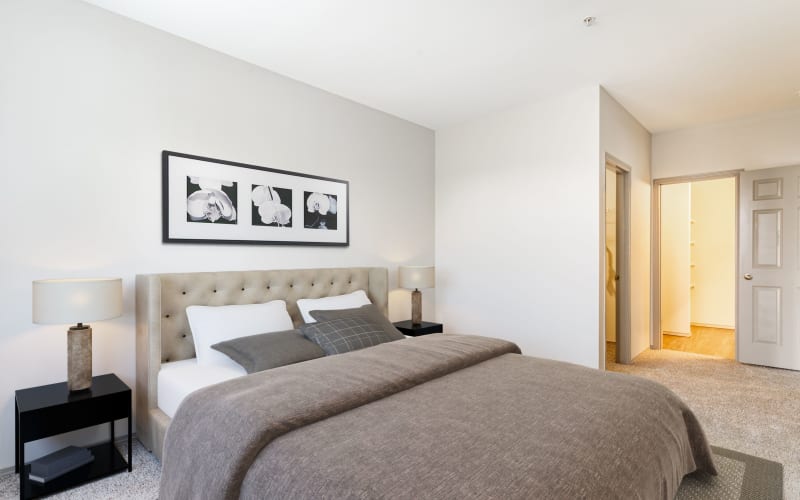 Spacious bedroom with paintings on the wall at Brookside Village in Auburn, Washington