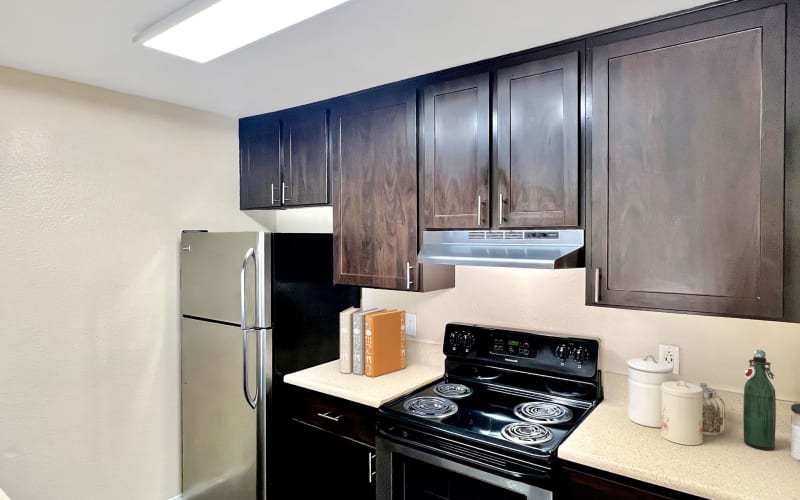 Espresso Cabinetry Kitchen at Hillside Terrace Apartments in Lemon Grove, California