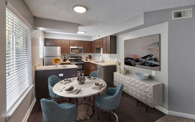 Enjoy updated espresso cabinetry in kitchens at Arapahoe Club Apartments in Denver, Colorado