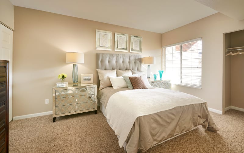 Spacious master bedroom with plush carpeting at Villas at Homestead Apartments in Englewood, Colorado