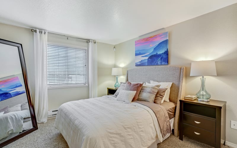Spacious master bedroom with plush carpeting at Walnut Grove Landing Apartments in Vancouver, Washington