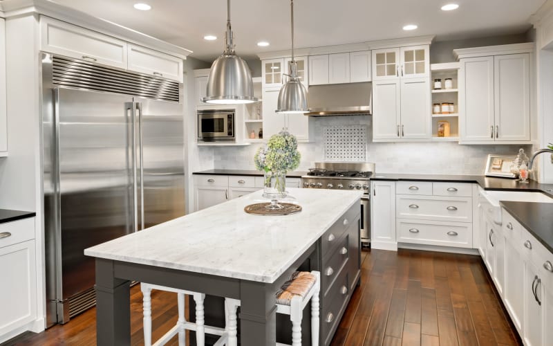 Renovated kitchen with white cabinets at View Ridge in Burien, Washington