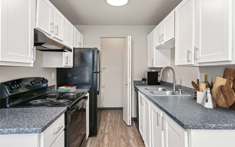 New Renovated Kitchen With White Cabinets at Wellington Apartment Homes in Silverdale, Washington