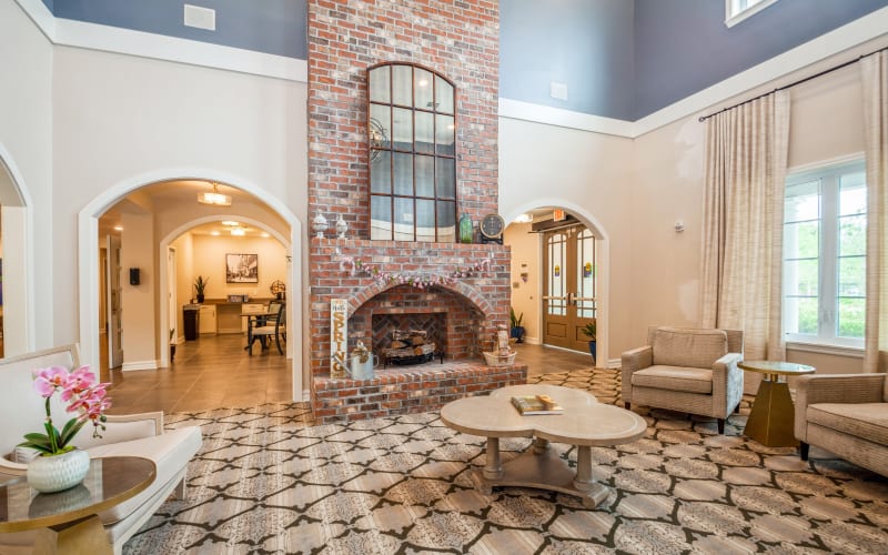 Large brick fireplace lounge at Barclay House of Baton Rouge in Baton Rouge, Louisiana