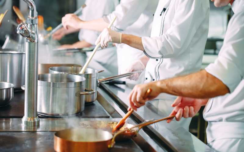 Chefs cooking at Nouveau Marc in Kenner, Louisiana