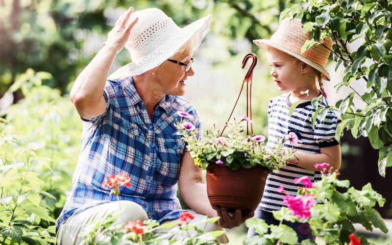 Resident gardening with granddaughter at River's Edge in Savannah, Georgia