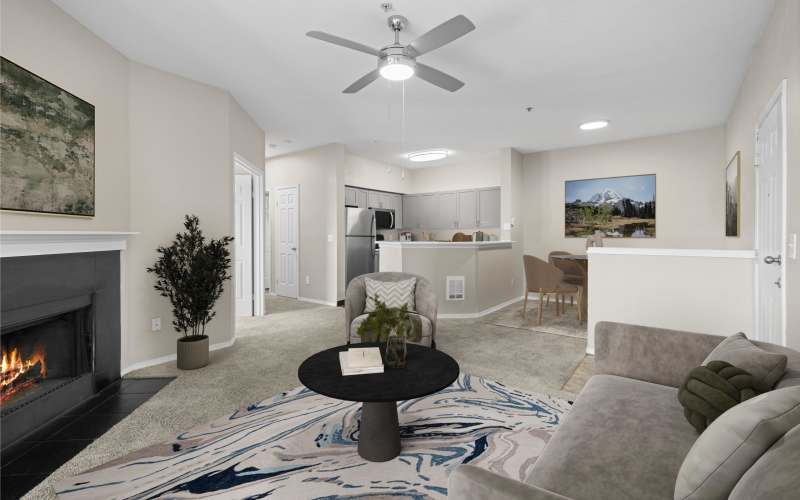 Renovated Brown Kitchen and Living Room with Fireplace at Wildreed Apartments in Everett, Washington