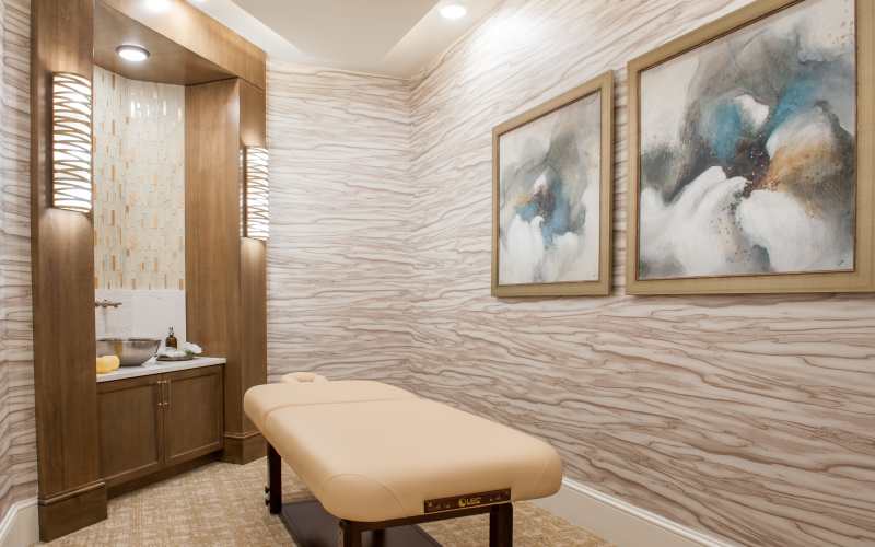 Young man having a conversation an elderly woman at The Barclay at Santa Rosa Beach in Santa Rosa Beach, Florida