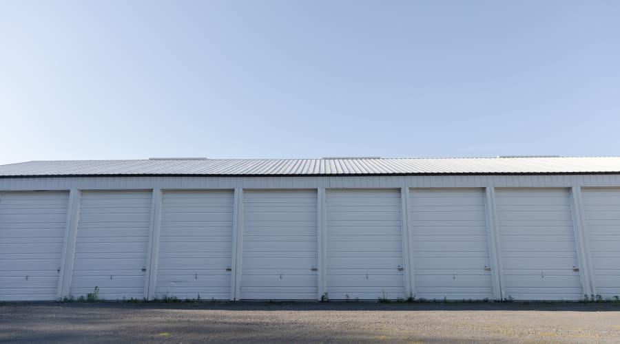 Storage units with white doors at KO Storage of Amery in Amery, Wisconsin