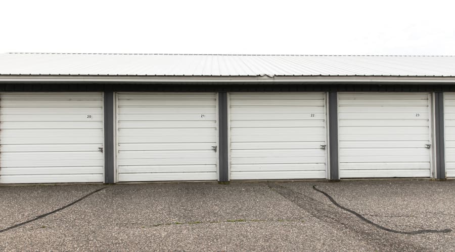Storage units with white doors at KO Storage of Maple Lake - Lumber in Maple Lake, Minnesota
