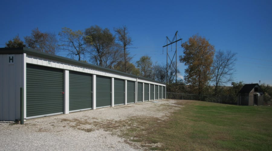 Storage units with blue doors and locks at KO Storage in Brookline, Missouri