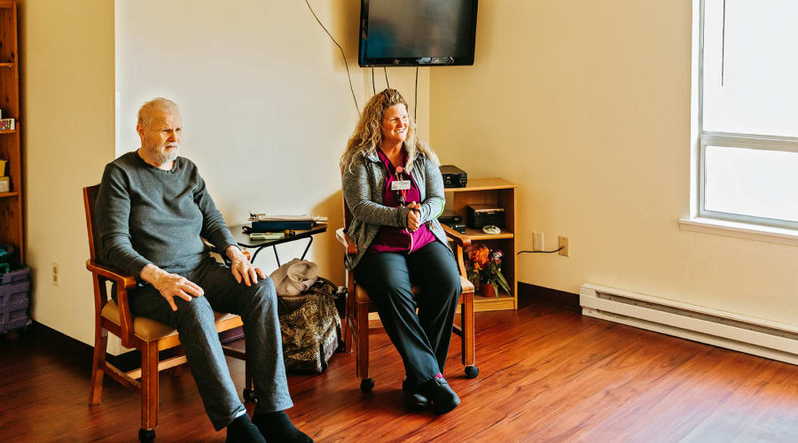 Two residents in sitting area at 6th Ave Senior Living in Tacoma, Washington