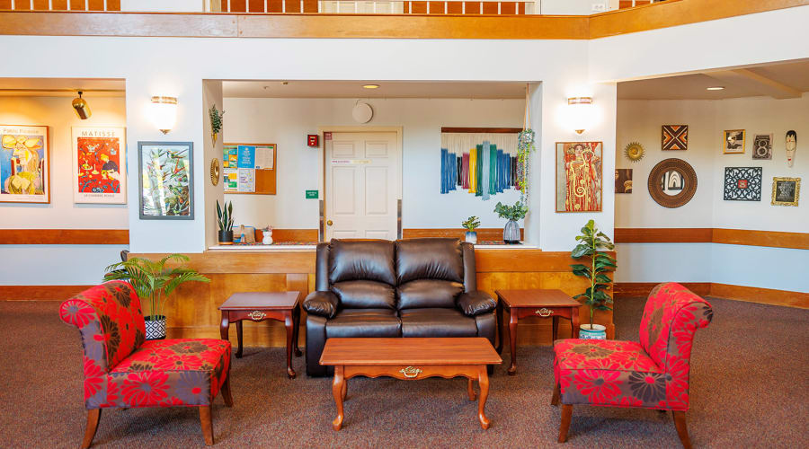 Assisted living resident discussing care options with family members and a caregiver at Peoples Senior Living in Tacoma, Washington