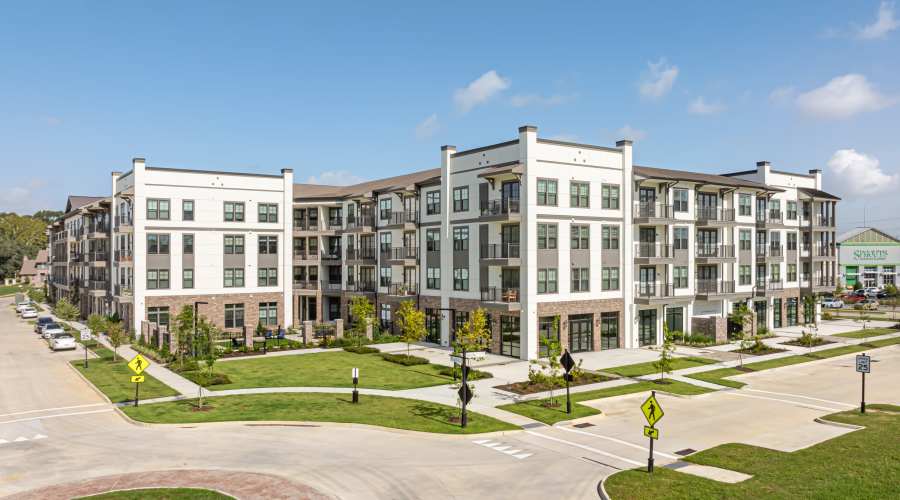 Residents hugging at The Everly at Rouzan in Baton Rouge, Louisiana
