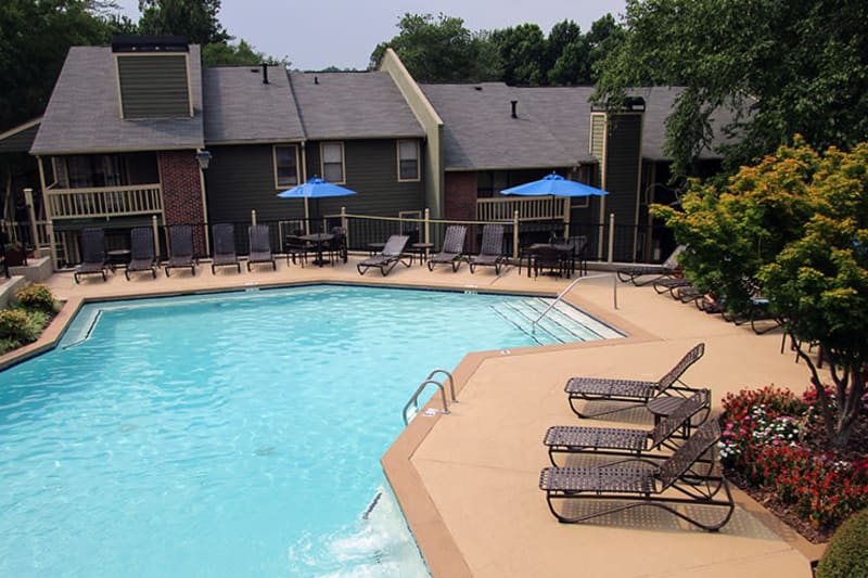 Chaise lounge chairs near the pool on a beautiful day at The Everette at East Cobb in Marietta, Georgia