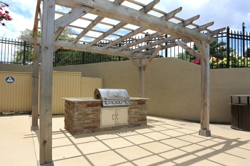 Pergola over the barbecue area with gas grills at The Everette at East Cobb in Marietta, Georgia