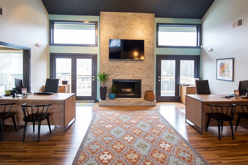 Lounge area with a fireplace in the clubhouse at The Everette at East Cobb in Marietta, Georgia