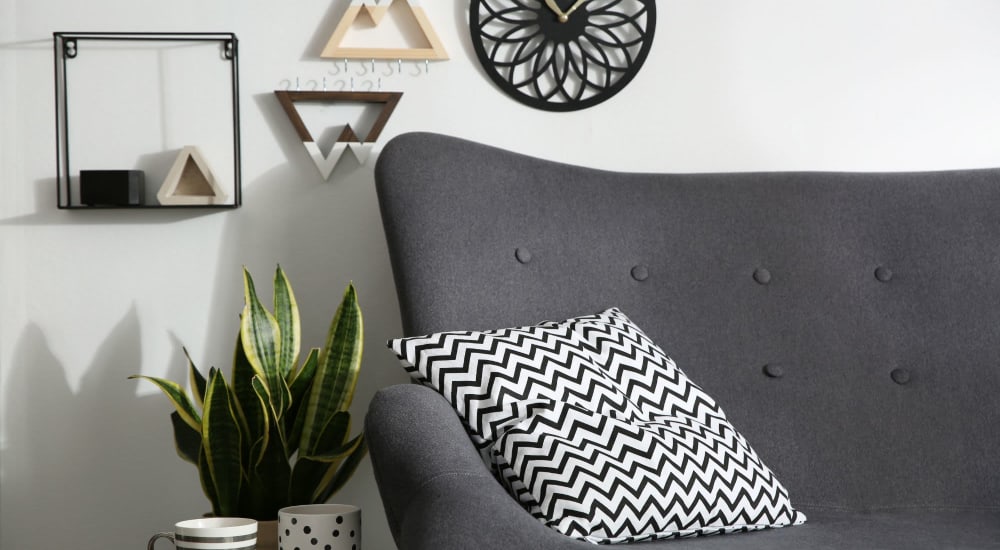 Comfortable couch in a model home's living space at Center West Apartments in Midlothian, Virginia