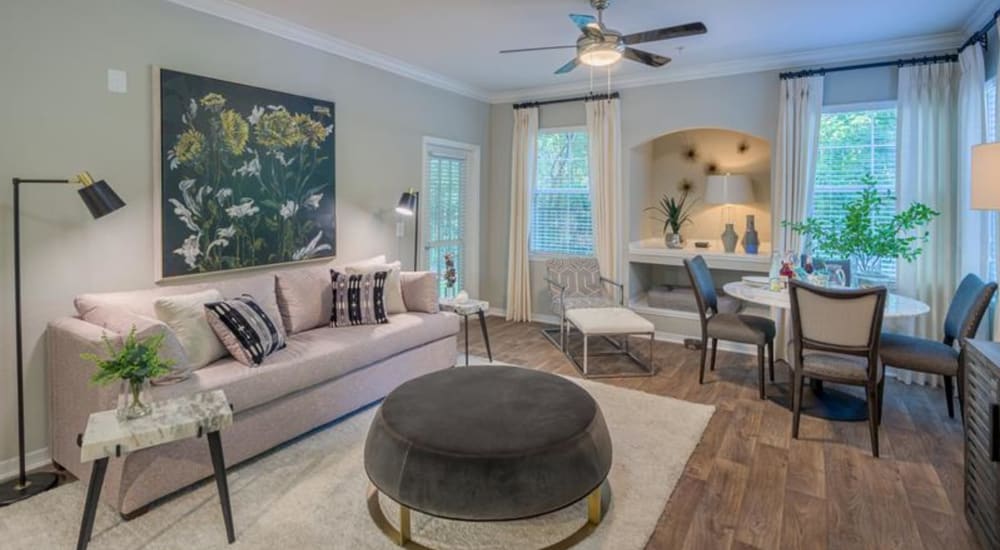 Wood flooring in a furnished apartment living room and dining room at Evergreens at Mahan in Tallahassee, Florida