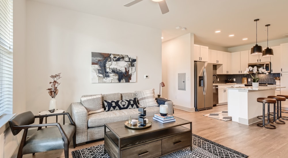 Wood flooring in an apartment living room and kitchen at Cypress McKinney Falls in Austin, Texas