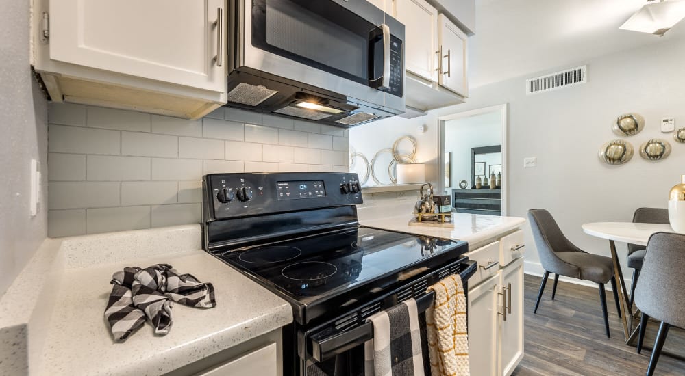 Residents relax in their new apartment at The Grove in Houston, Texas