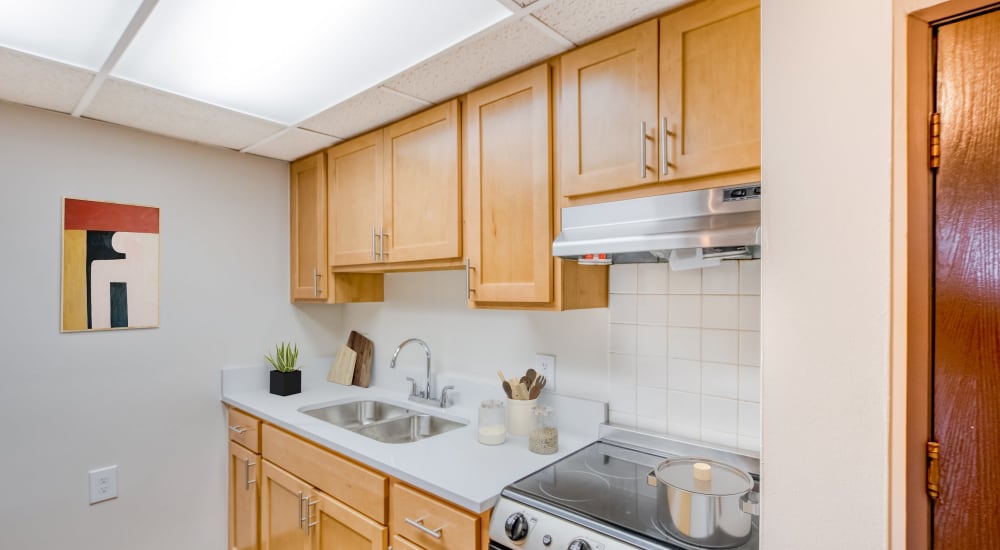 Fully equipped kitchen with new wood cabinetry at Bowin Place in Detroit, Michigan