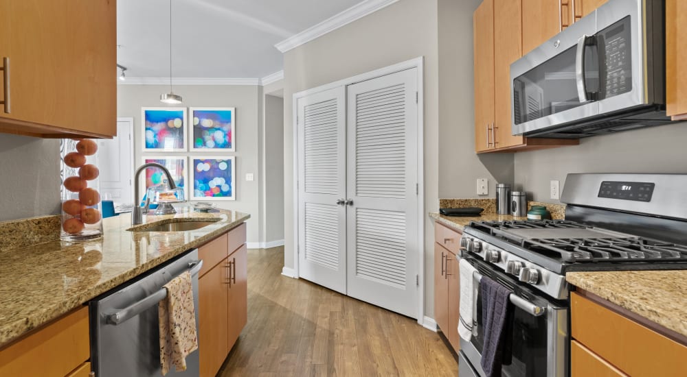 A furnished living room and dining room in a model apartment at Residences at Congressional Village in Rockville, Maryland