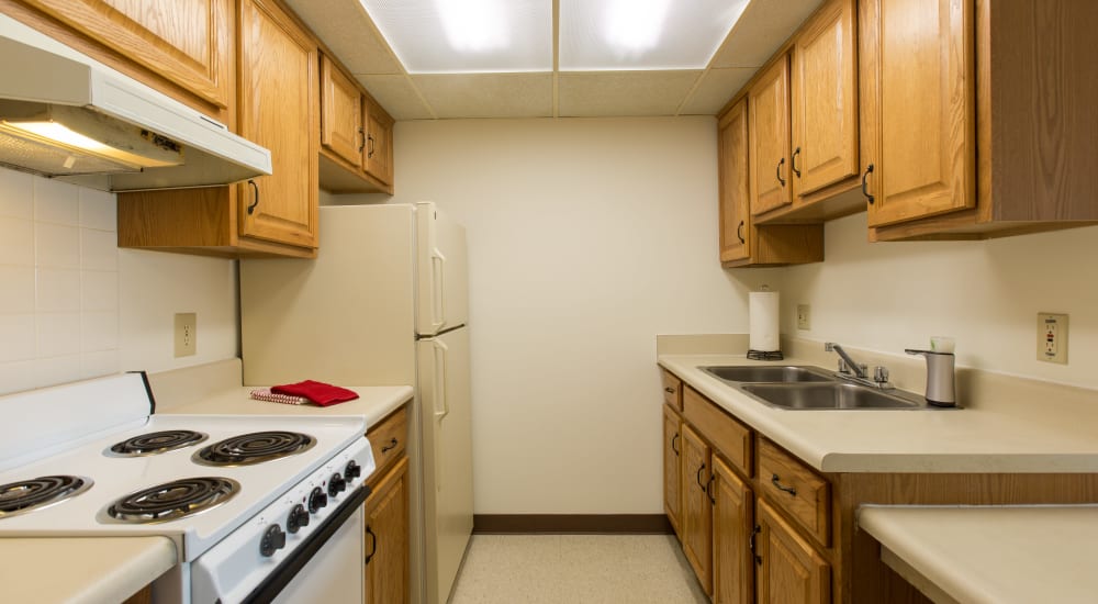 Fully equipped kitchen with cabinetry at North Port Village in Port Huron, Michigan