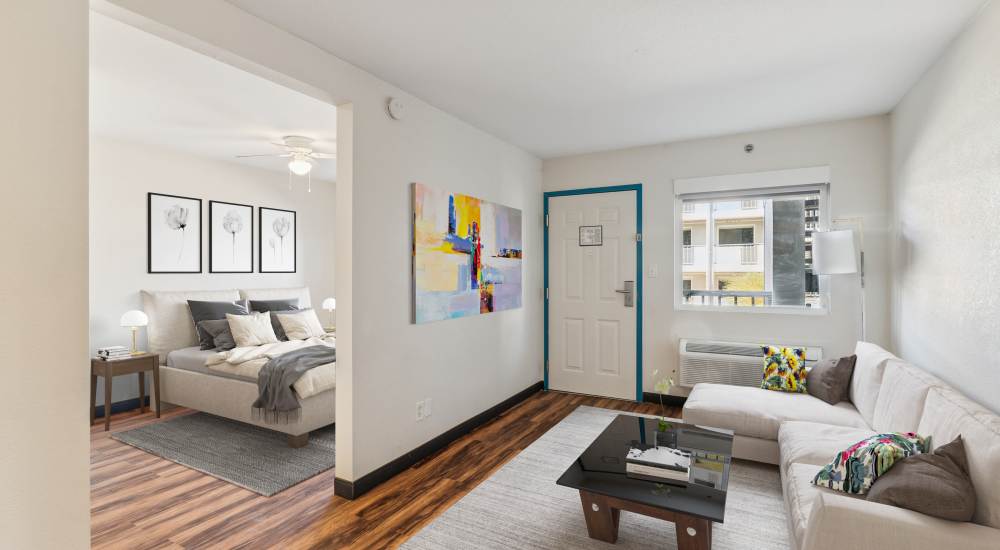 Living room with wood-style flooring at Atrium Flats in Nashville, Tennessee