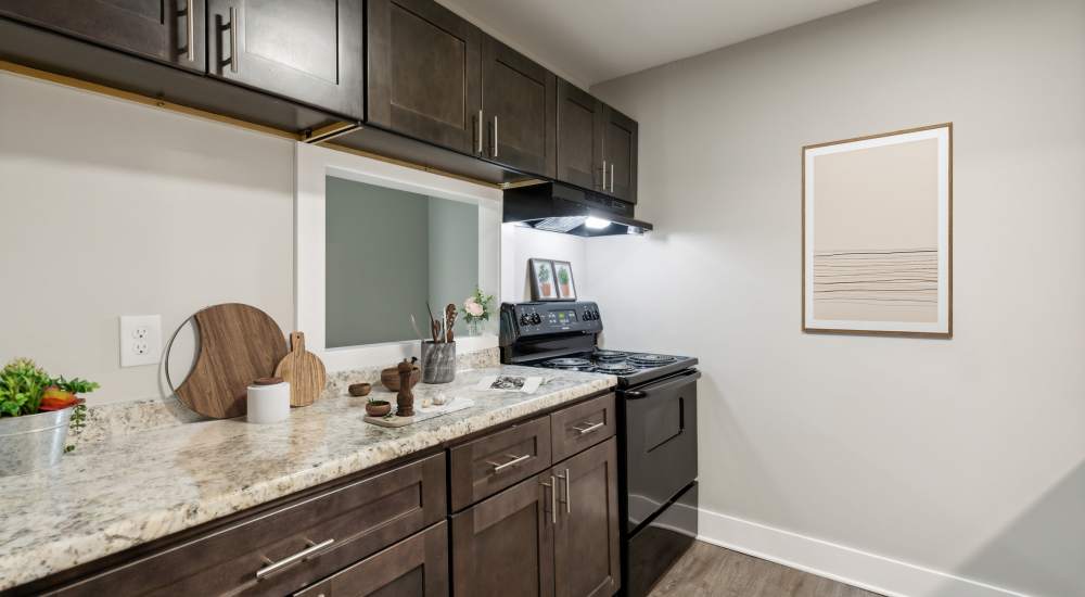 Apartment kitchen with wood style flooring at Cityvue @5101 in Nashville, Tennessee